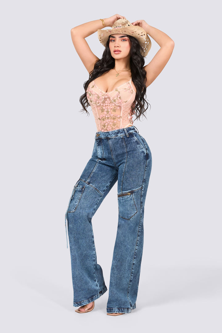 Mid-rise jeans with a wide leg, designed for comfort, in a medium blue shade. 