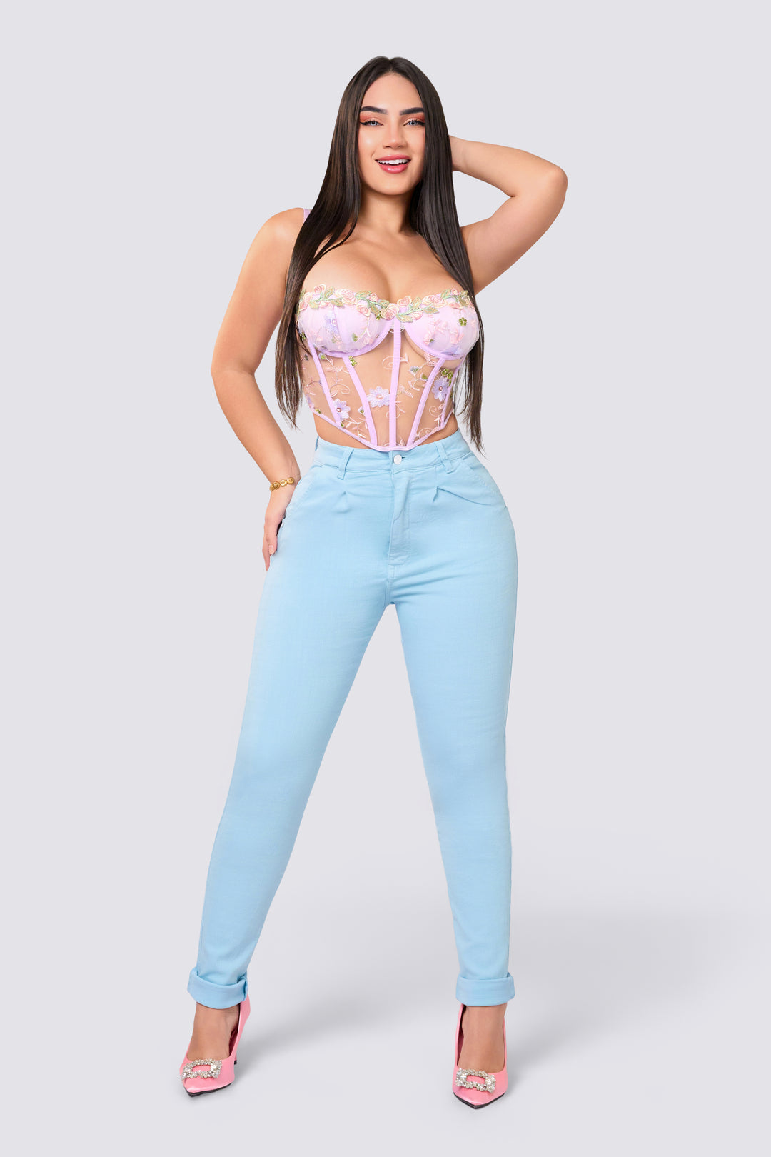 Light blue skinny jeans, high rise, slim waistband with a single button.