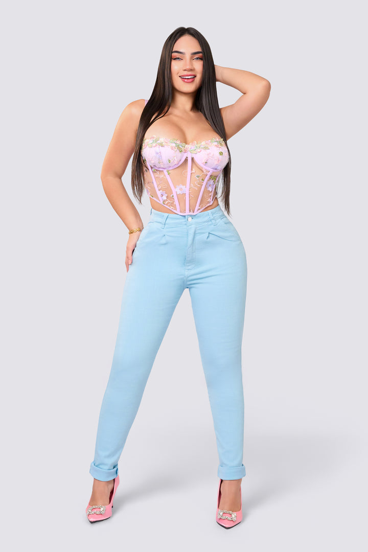 Light blue skinny jeans, high rise, slim waistband with a single button.