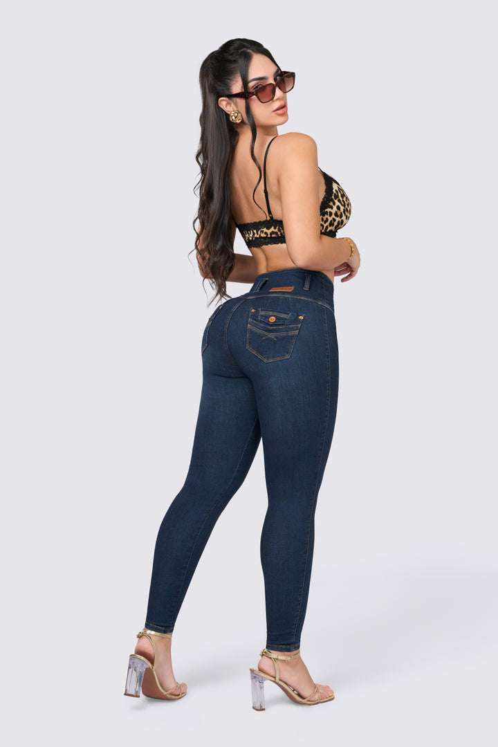 Navy blue skinny jeans, high waist, side buttons.