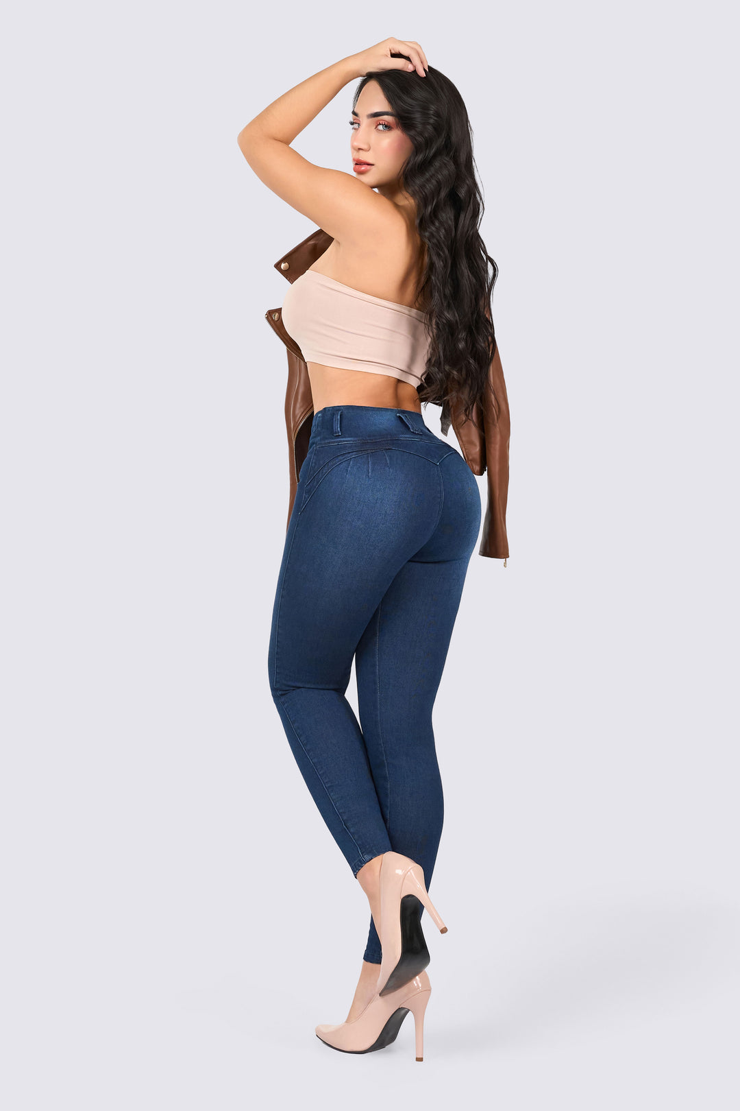 Dark blue skinny jeans with a slim waistband, a high-rise design, and a form-fitting cut. 