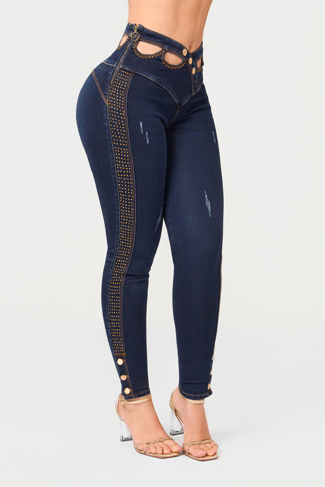 Dark blue skinny jeans with rhinestone details, side zipper, and a unique, elegant design. 